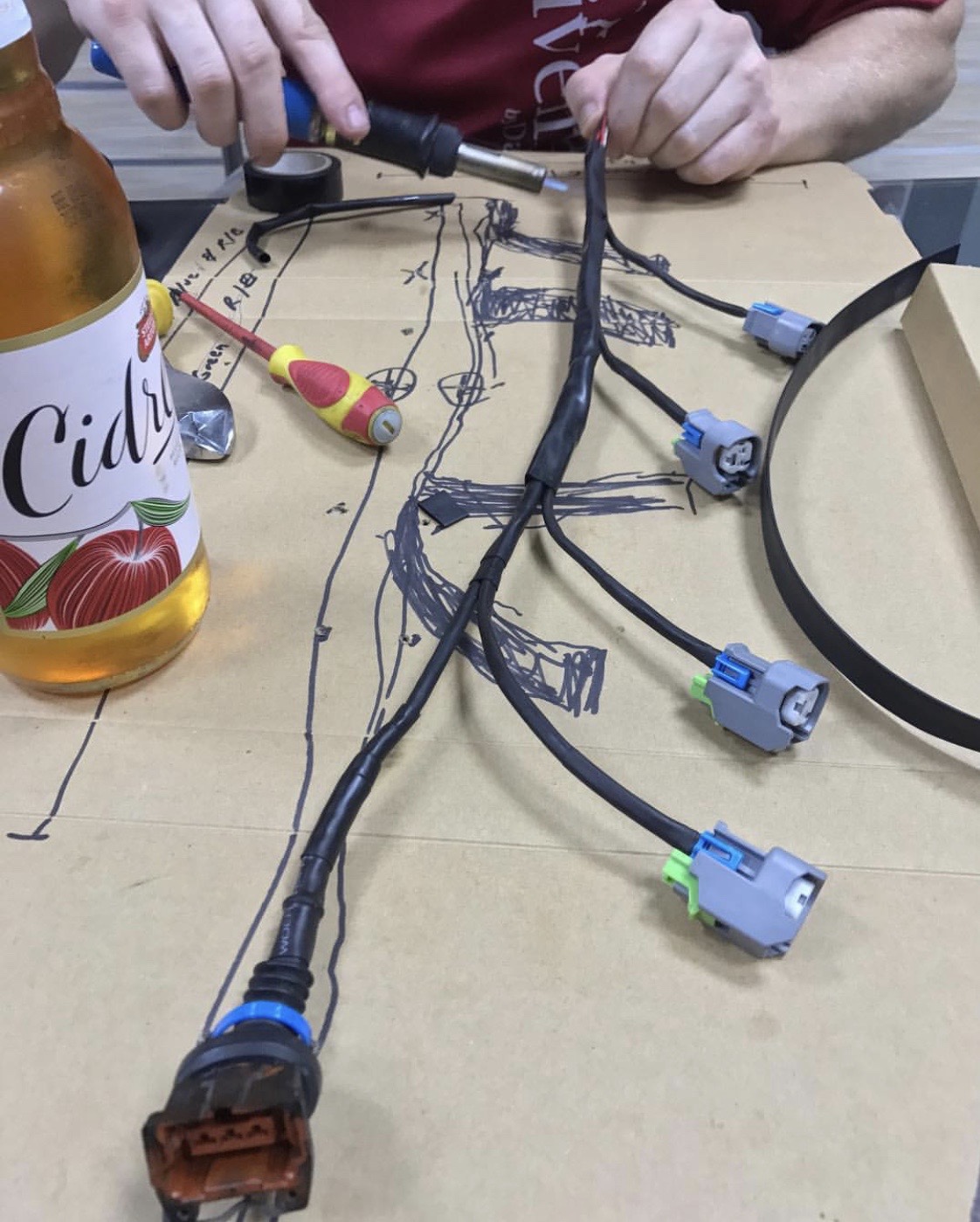 Hand-built injector wiring harness on the workbench