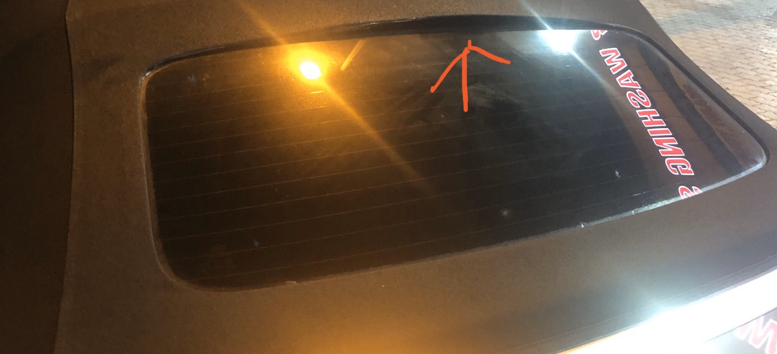 Convertible roof rear glass separating from the surrounding soft-top fabric